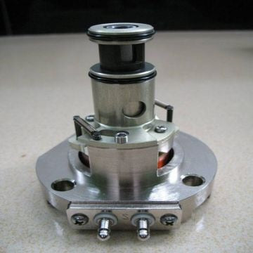 Fail-safe hydraulic actuator mounted on an industrial valve, with a vertical cylindrical body and visible hydraulic connections
