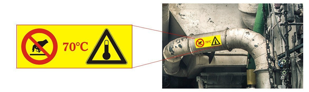 Etiqueta adhesiva de aviso de superficie caliente con «70 °C» aplicada sobre una tubería industrial metálica.